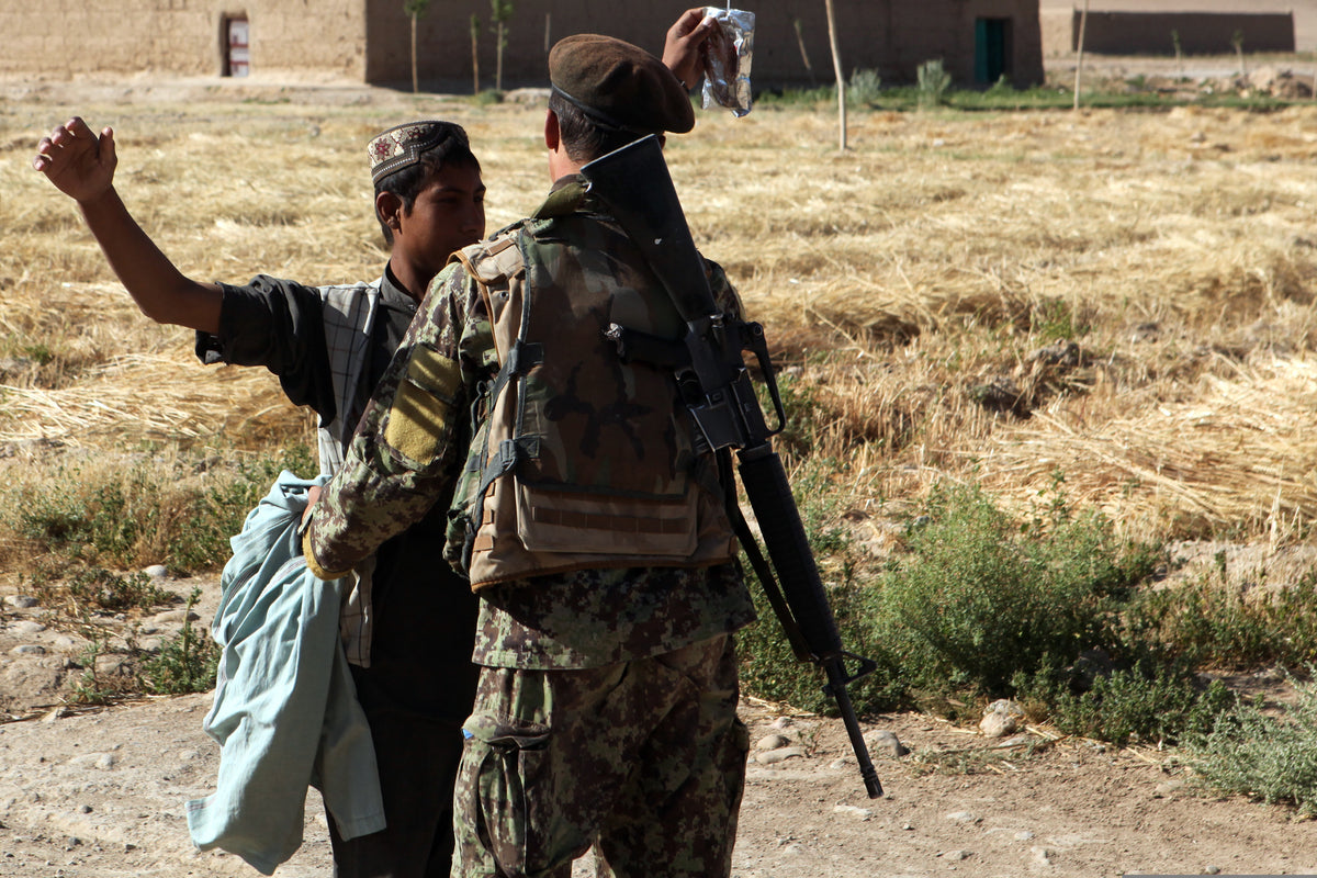 Afghan National Army soldier on a partnered security patrol in Sangin, Helmand Province, in June 2012