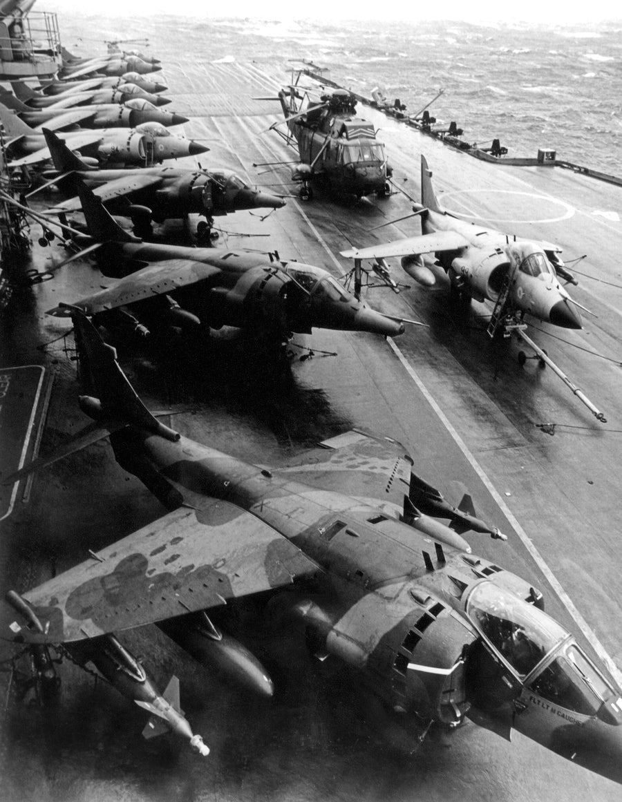 Sea Harriers and RAF Harrier GR.3 aircraft on HMS Hermes in the South Atlantic, 19 May 1982