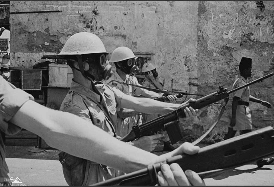 British soldiers wearing respirators during the Aden Emergency