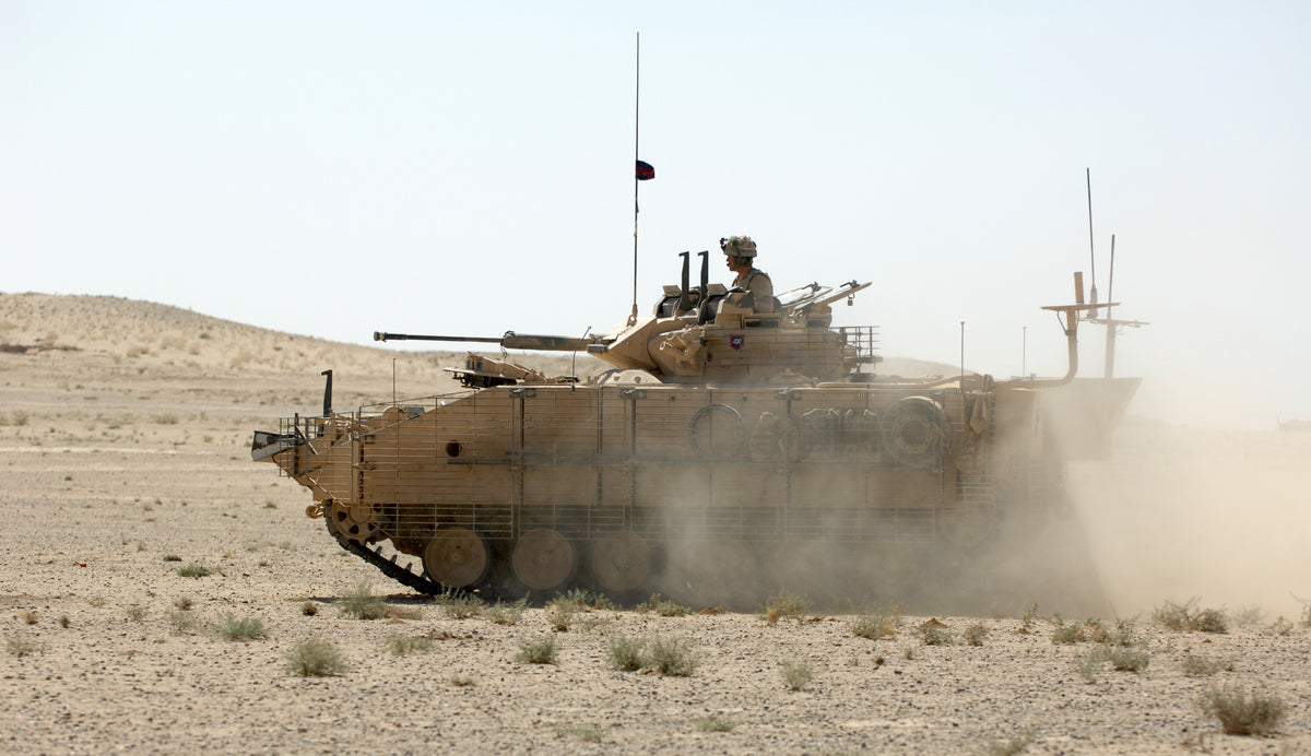 British Army Warrior infantry fighting vehicle providing overwatch on the edge of the Green Zone in Helmand Province, Afghanistan