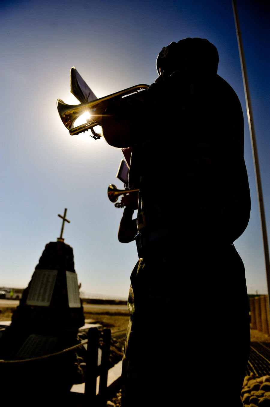 A British Army bugler sounding the Last Post during a Remembrance service at Camp Bastion in 2010