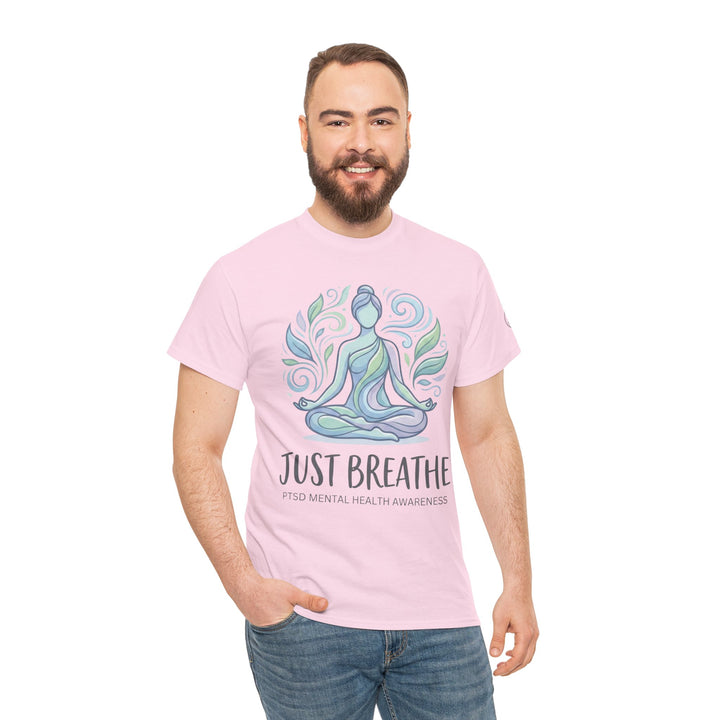Pink T-shirt with mental health design by Veteran owned, featuring a meditating figure and "Just Breathe" text.