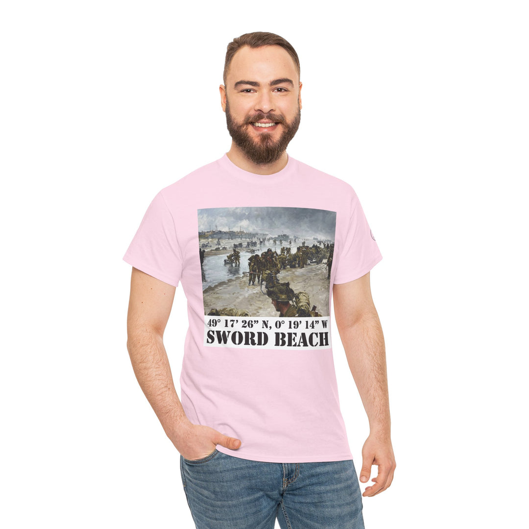 Pink t-shirt by Veteran owned, featuring a Sword Beach image and coordinates, worn with blue jeans.