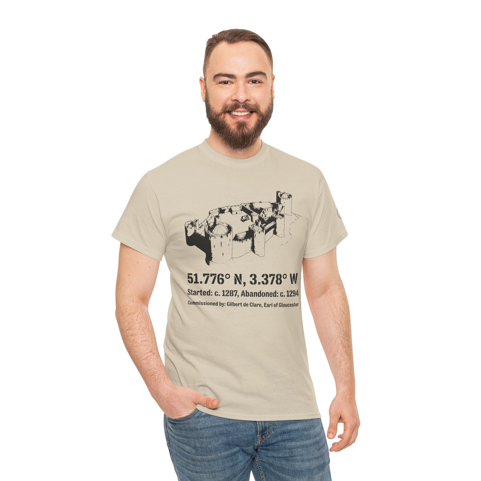 Beige Morlais Castle T-shirt by S&W Gallus, featuring a black castle illustration with location coordinates and historical information.