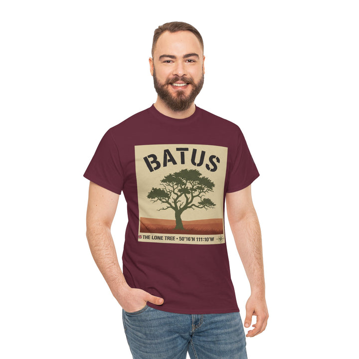 Burgundy t-shirt by S&amp;W Gallus, featuring a vintage safari tree graphic, and worn with jeans.