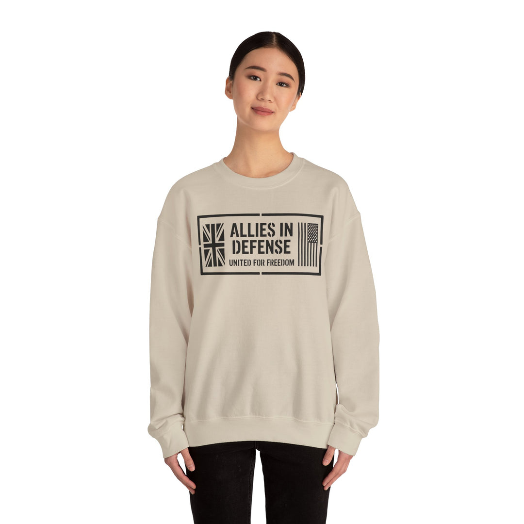 Sand-colored sweatshirt with "Allies in Defense" graphic by S&amp;W Gallus, featuring UK and US flag symbols and "United for Freedom" text.
