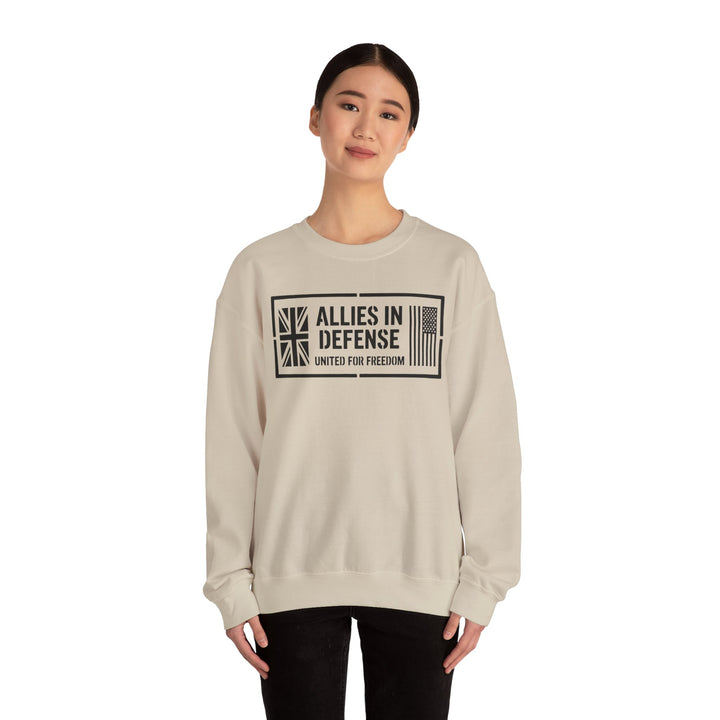 Sand-colored sweatshirt with "Allies in Defense" graphic by S&amp;W Gallus, featuring UK and US flag symbols and "United for Freedom" text.