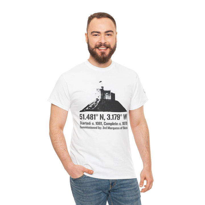 White Cardiff Castle T-shirt by S&amp;W Gallus, featuring a castle graphic with coordinates, paired with jeans on a smiling man.
