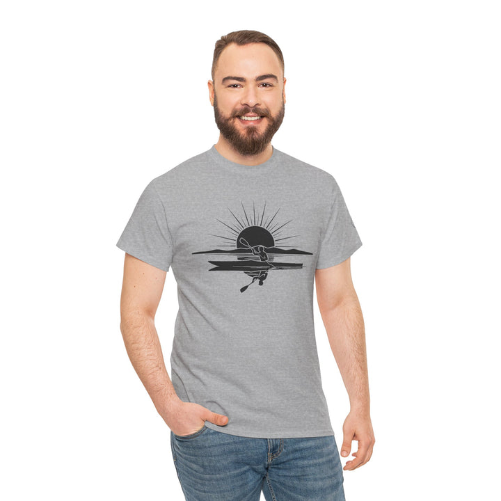 Gray t-shirt by S&amp;W Gallus featuring a kayak sunset graphic on the front, styled with jeans and worn by a bearded man.