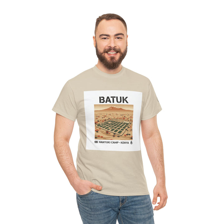 Beige graphic t-shirt by S&amp;W Gallus, featuring a landscape illustration with mountain and camp text, worn with jeans.