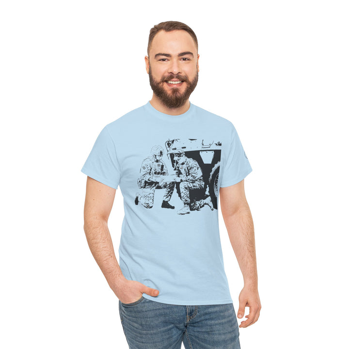 Light blue graphic t-shirt by S&amp;W Gallus with soldiers and a military vehicle, worn with jeans.