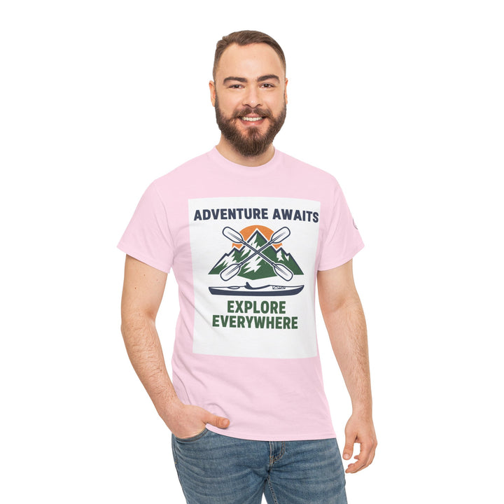 Pink T-shirt with adventure graphic by S&amp;W Gallus, on a model wearing jeans.