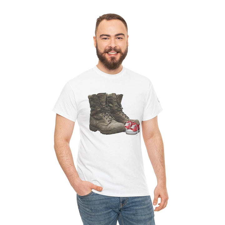Graphic T-shirt with boots and baby shoes graphic by S&amp;W Gallus, worn with jeans.