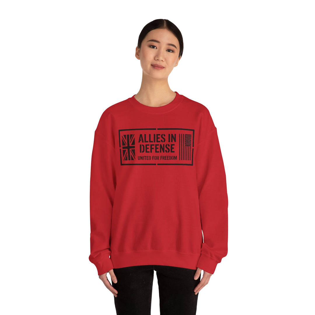Red crewneck sweatshirt by S&amp;W Gallus featuring "Allies in Defense" graphic with flags, worn with black pants.