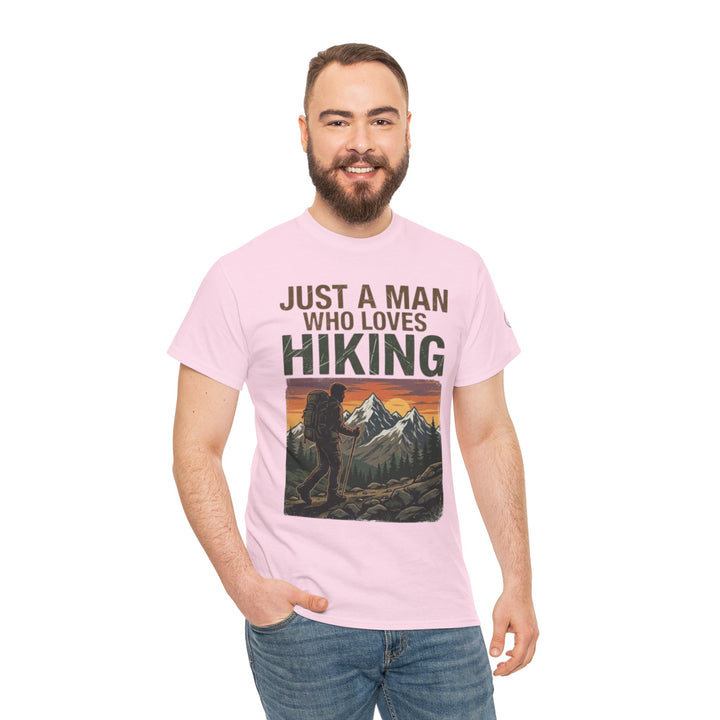 Pink graphic T-shirt by Veteran owned, featuring hiking and mountain design, worn with jeans.