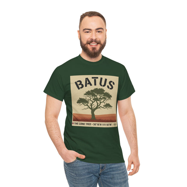 Green graphic t-shirt by S&W Gallus, featuring a desert landscape with a solitary tree and latitude and longitude coordinates.