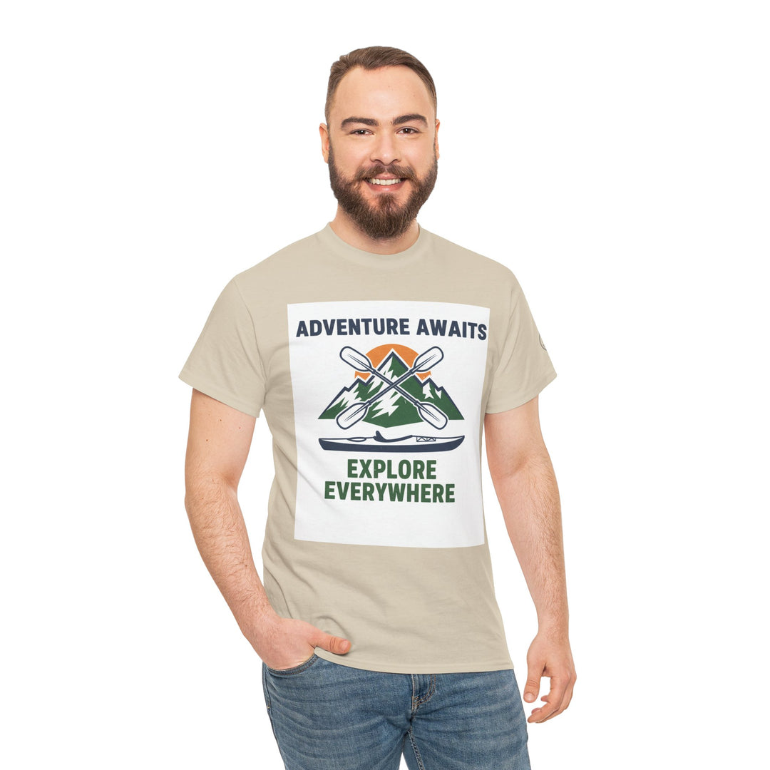Beige adventure t-shirt by S&amp;W Gallus, featuring a mountain and kayak graphic with the text "Adventure Awaits" and "Explore Everywhere."