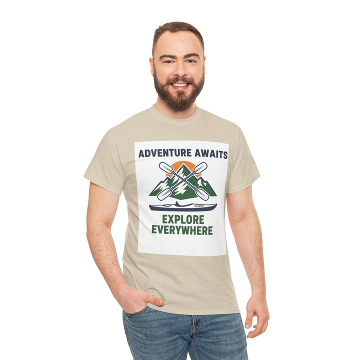 Beige adventure t-shirt by S&amp;W Gallus, featuring a mountain and kayak graphic with the text "Adventure Awaits" and "Explore Everywhere."