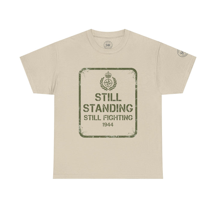 Beige "Still Standing" T-shirt by S&amp;W Gallus, featuring military-themed graphic print on the front.