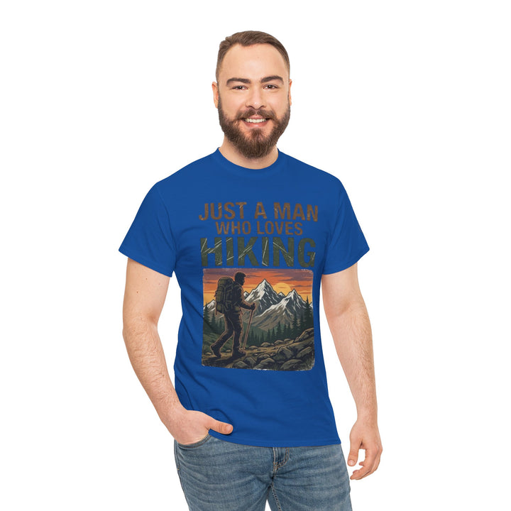 Blue graphic t-shirt by Veteran Owned, featuring a hiking-themed mountain illustration on the front, worn with denim jeans.