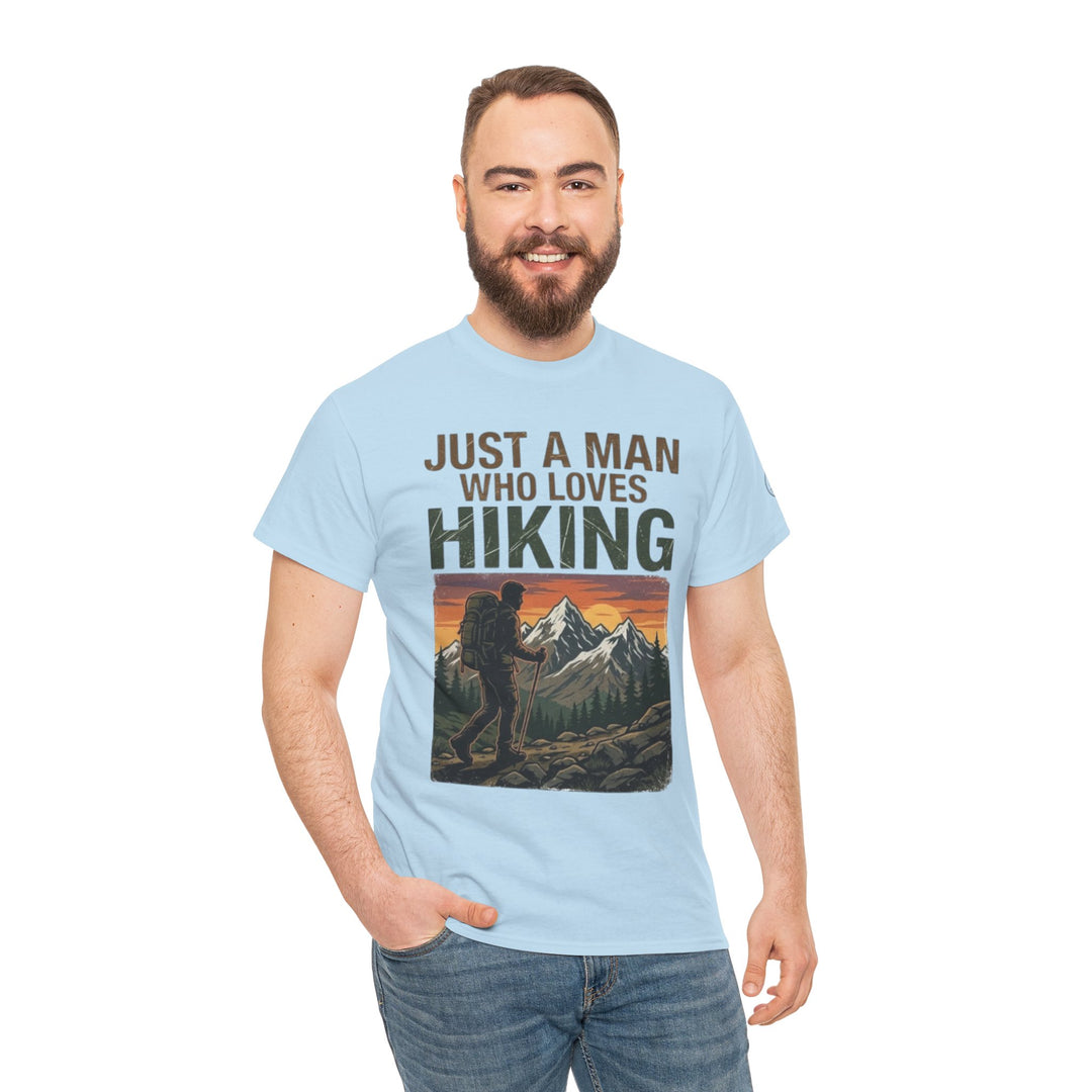 Light blue T-shirt with a hiking graphic by Veteran owned, paired with jeans on a standing man.