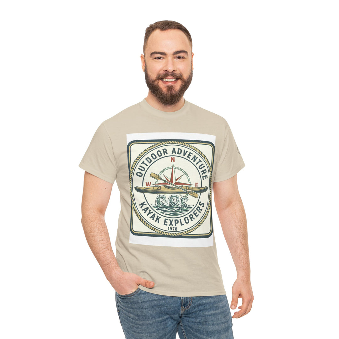 Beige t-shirt by S&amp;W Gallus featuring a square graphic with compass, kayak, and wave design, worn with jeans.