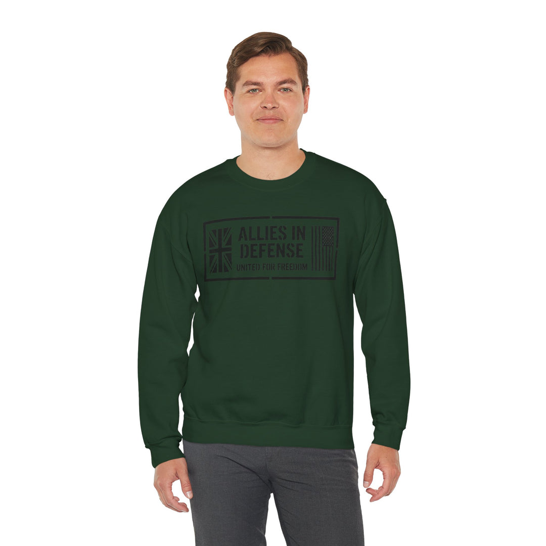 Forest green crewneck sweatshirt by S&amp;W Gallus with "Allies in Defense" graphic on the front, paired with gray pants.