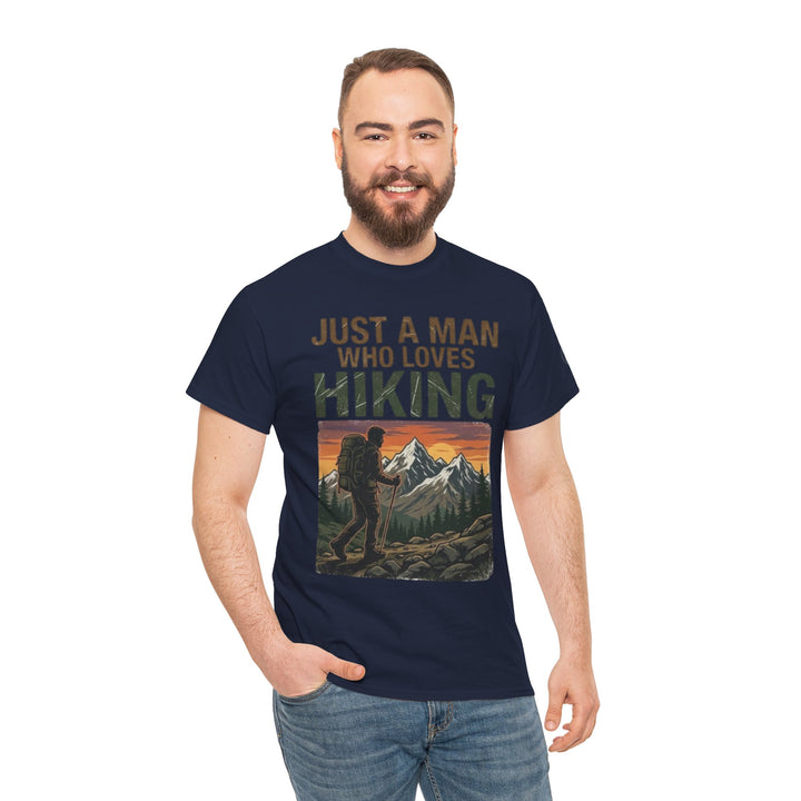 Navy blue graphic t-shirt by Veteran owned, featuring a hiking-themed design, worn with jeans.