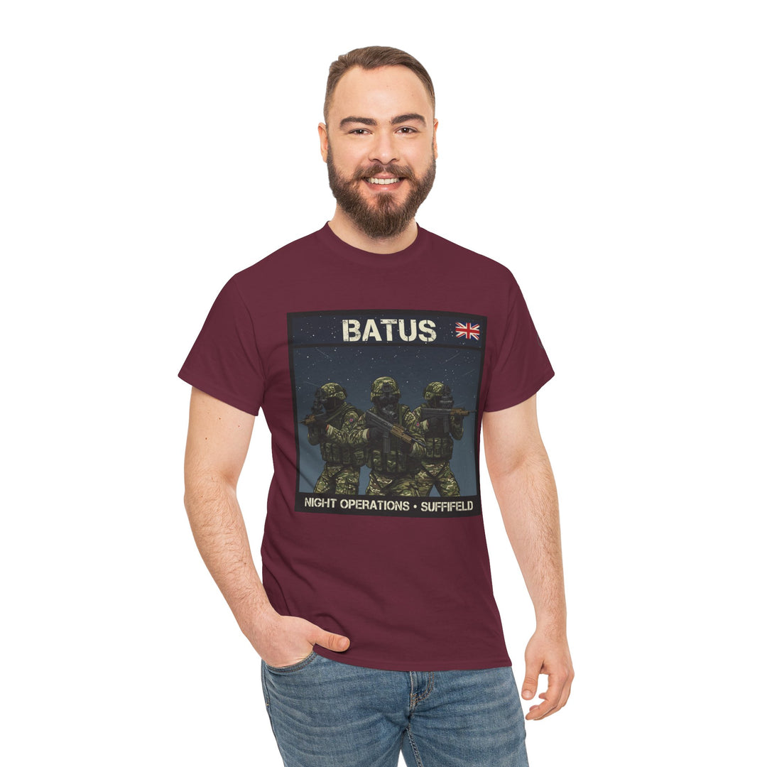 Maroon t-shirt with military graphic by S&amp;W Gallus, featuring soldiers and "BATUS" text, worn with jeans by a smiling model.