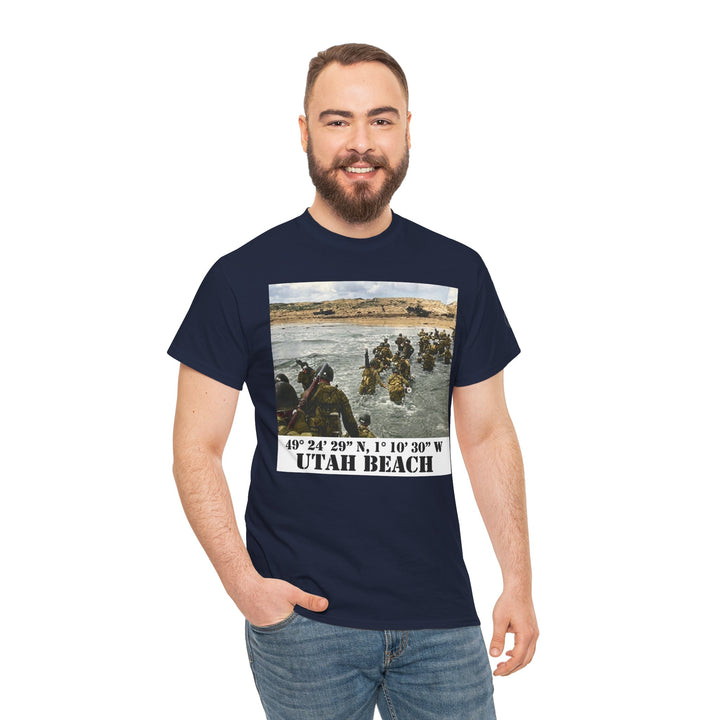 Navy t-shirt for men by Veteran owned, featuring a photo of Utah Beach with coordinates. Model wears with jeans.