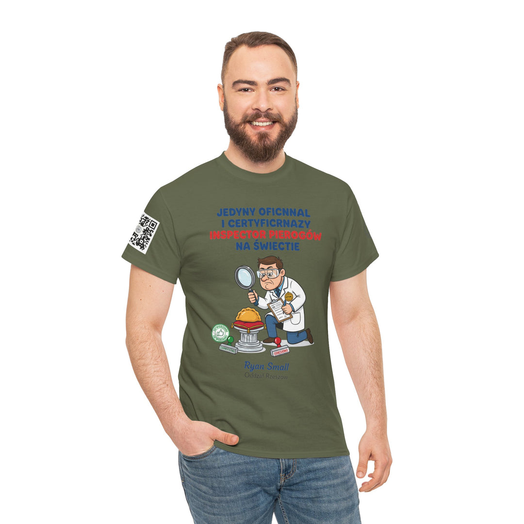 Olive green t-shirt by S&amp;W Gallus, featuring a pierogi inspector cartoon and humorous Polish text, worn by a smiling man with jeans.