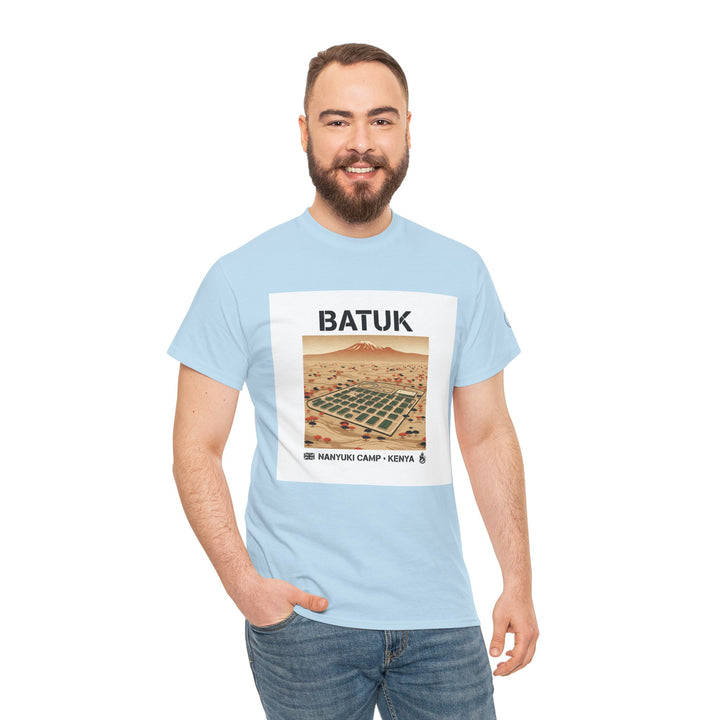 Light blue graphic T-shirt by S&amp;W Gallus, featuring a Nanyuki Camp desert landscape design and worn with blue jeans.