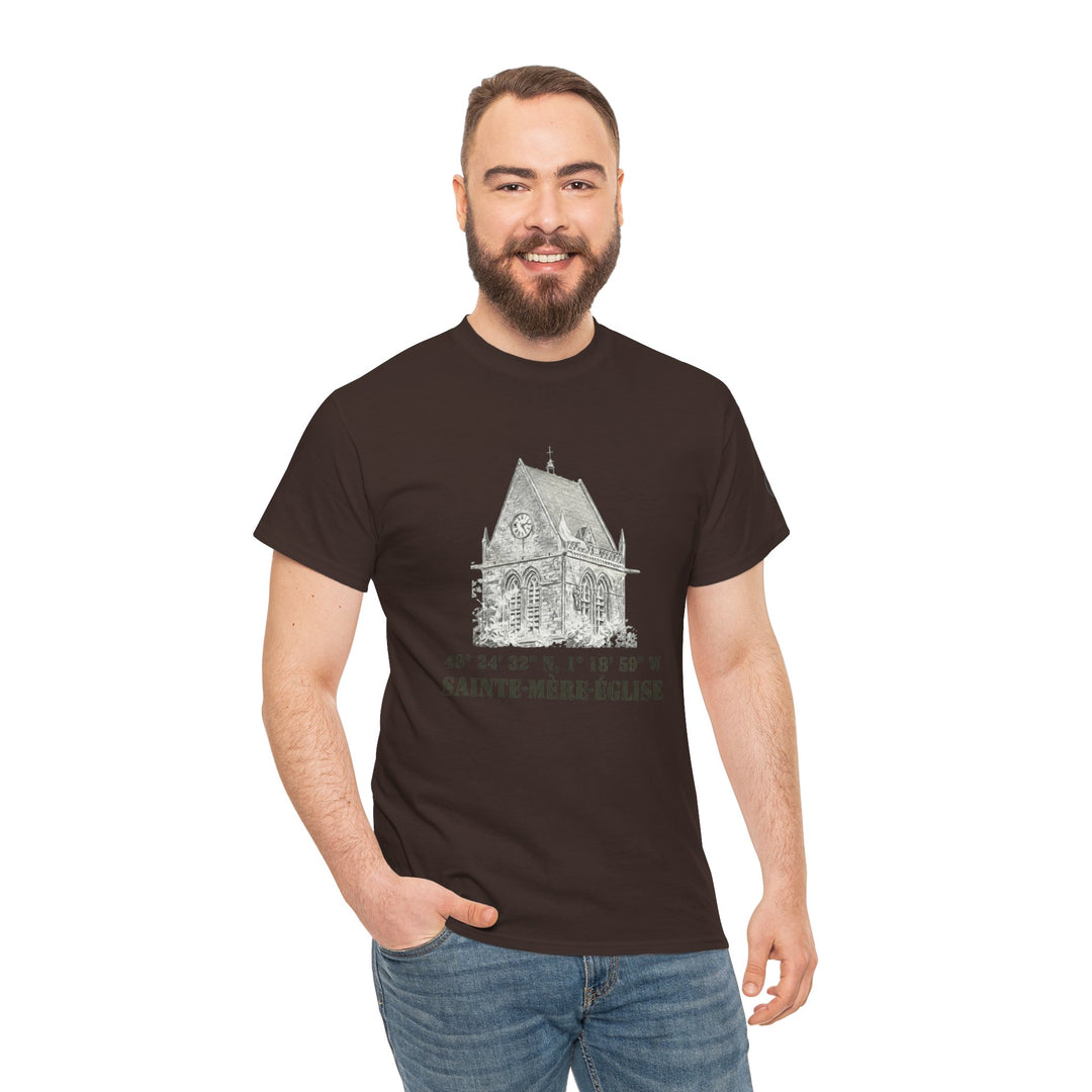 Brown Sainte-Mère-Église 1944 Vintage Church T-Shirt from Veteran owned, featuring a church sketch and coordinates, styled with jeans.