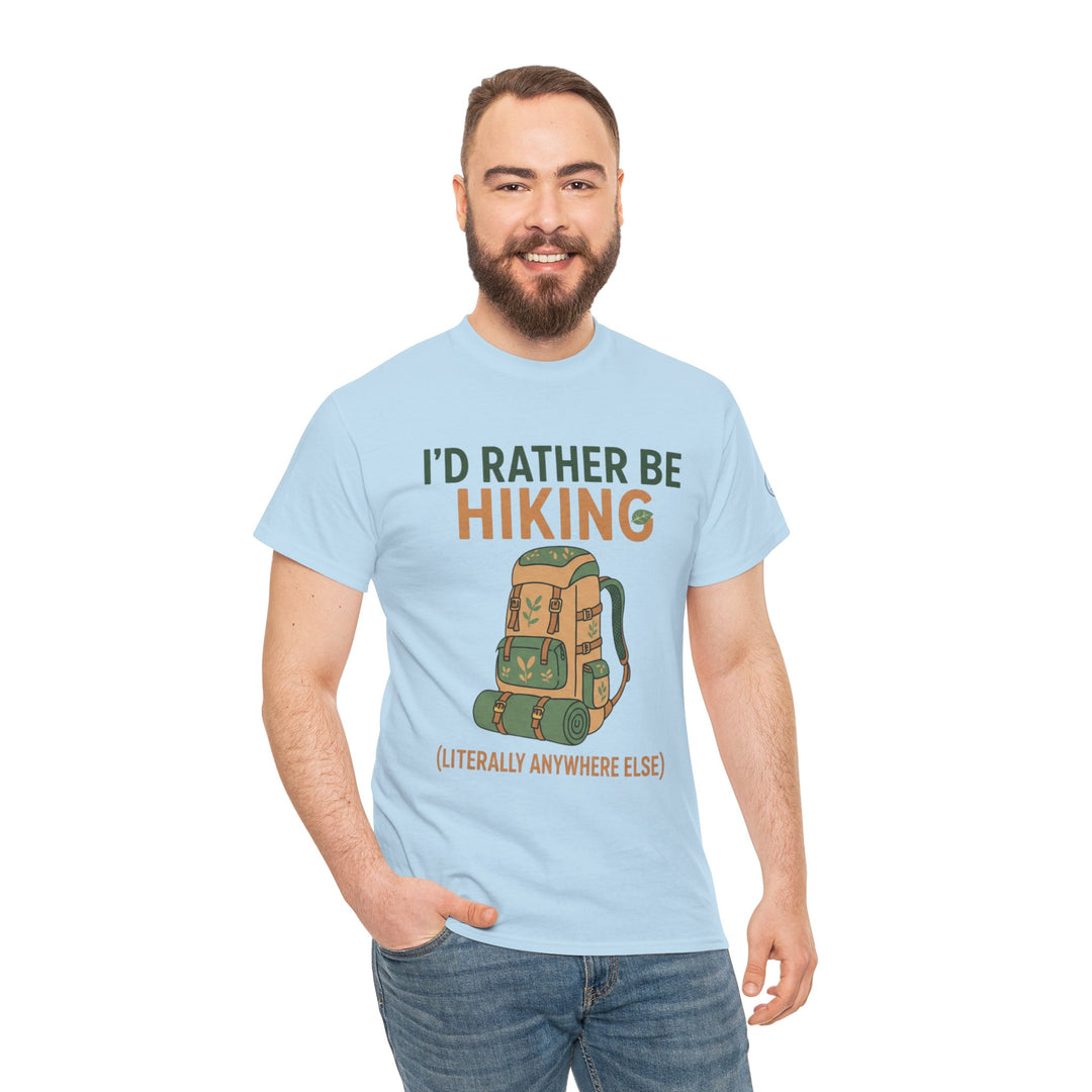 Light blue hiking-themed T-shirt by S&amp;W Gallus, featuring a cartoon backpack graphic and printed text, worn with blue jeans.