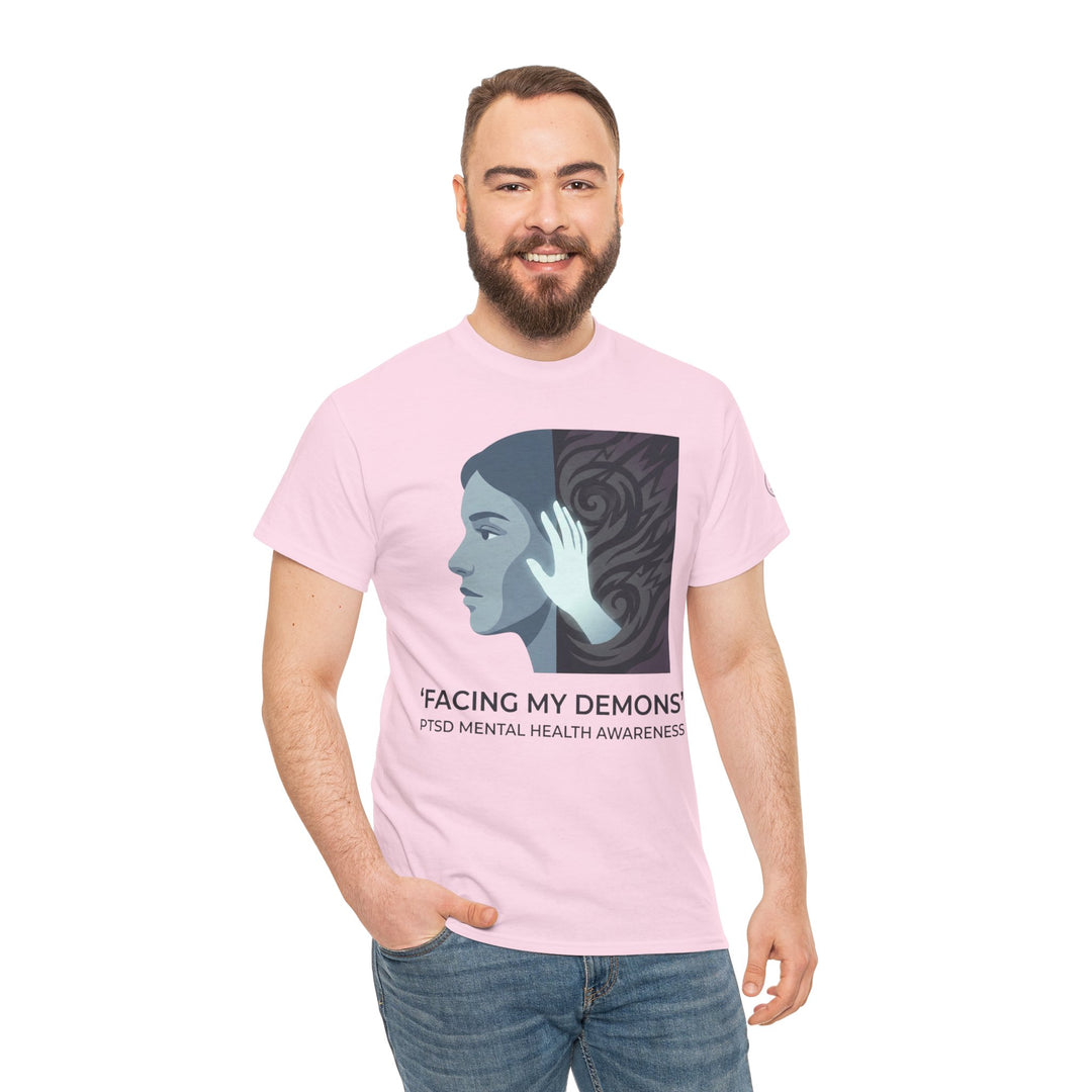 Light pink t-shirt by Veteran owned, featuring a graphic print and text promoting PTSD mental health awareness, worn with jeans.