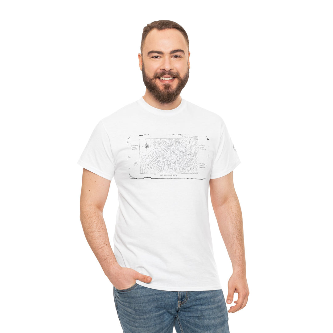 White T-shirt with a mountain map graphic by S&amp;W Gallus, worn with blue jeans by a smiling man.