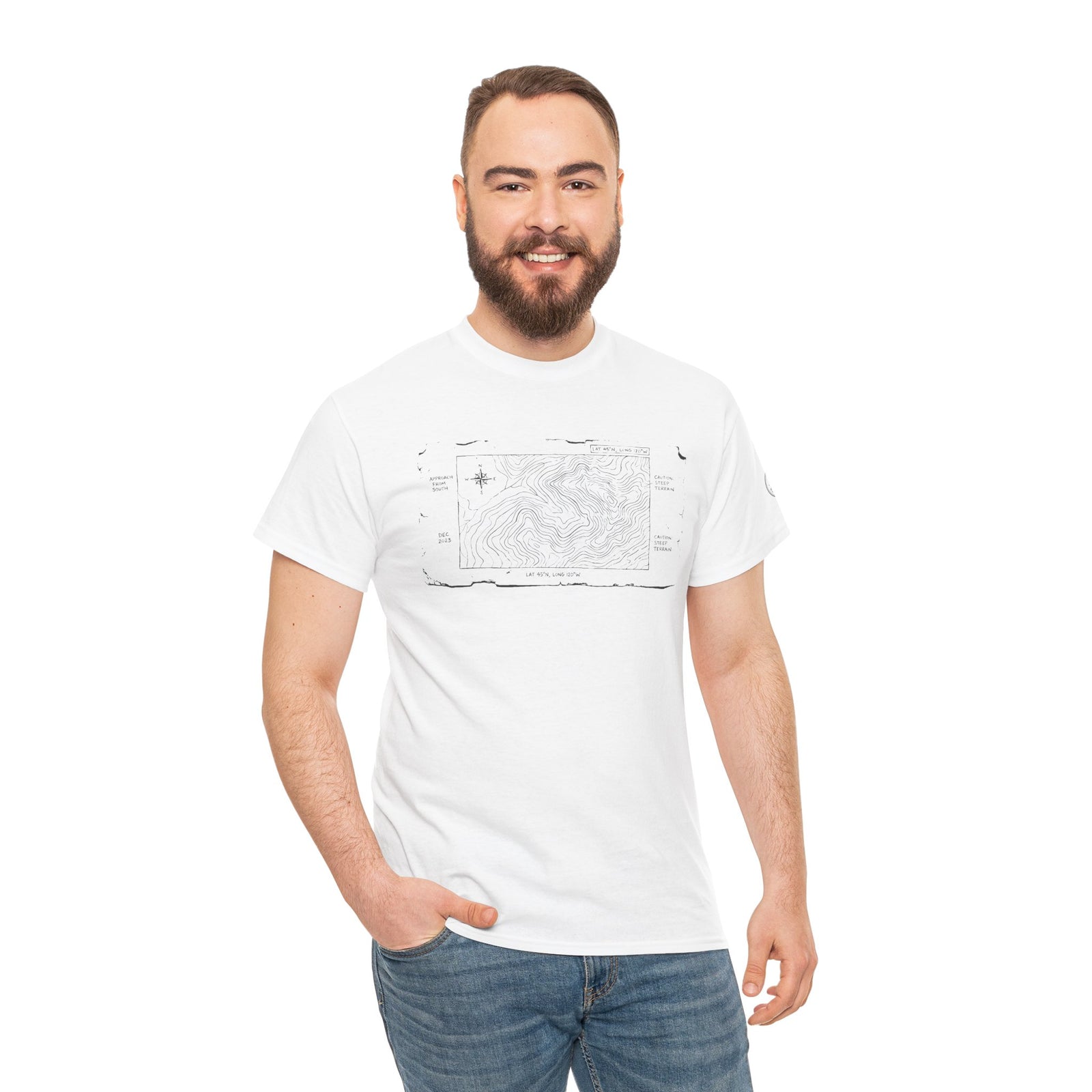 White T-shirt with a mountain map graphic by S&W Gallus, worn with blue jeans by a smiling man.