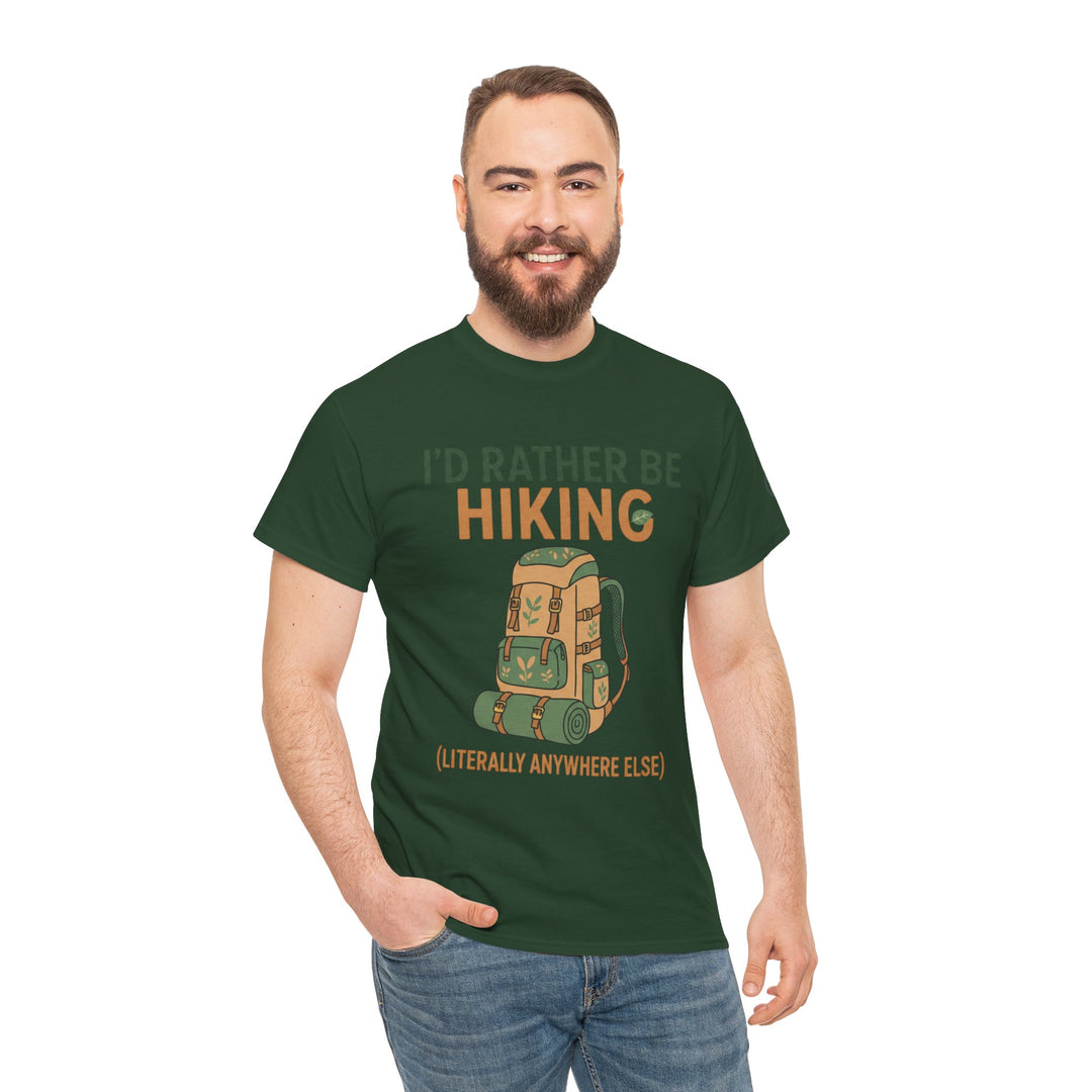 Green hiking t-shirt by S&amp;W Gallus featuring a backpack graphic and humorous text, worn with jeans by a smiling man.