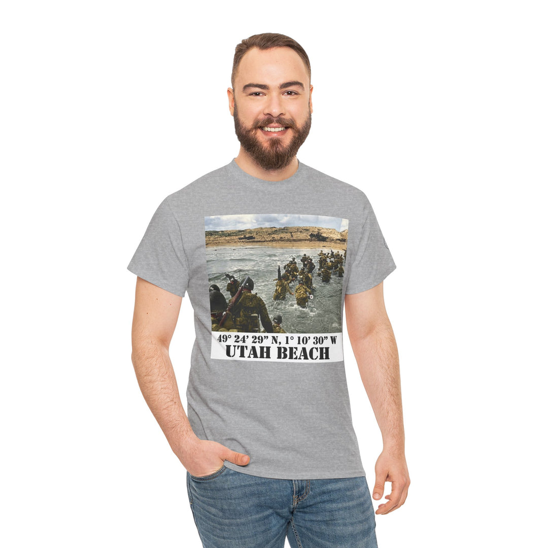 Gray graphic t-shirt by Veteran owned, featuring a historical image and "Utah Beach" text, worn with jeans.