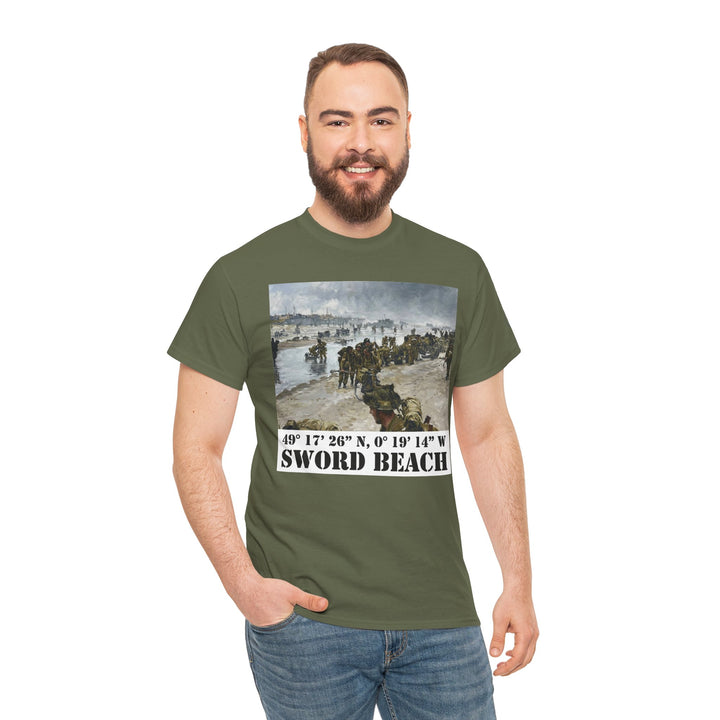 Olive green t-shirt with "Sword Beach" image by Veteran owned, shown on a smiling man wearing jeans.
