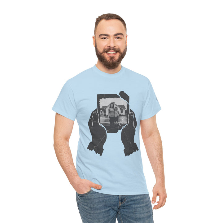 Light blue t-shirt by S&amp;W Gallus featuring black and white image of a woman and child in front of a house.