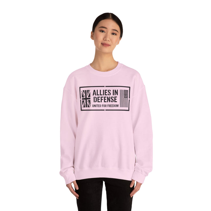 Light pink crewneck sweatshirt by S&amp;W Gallus featuring an "Allies in Defense" graphic with British and American flags.