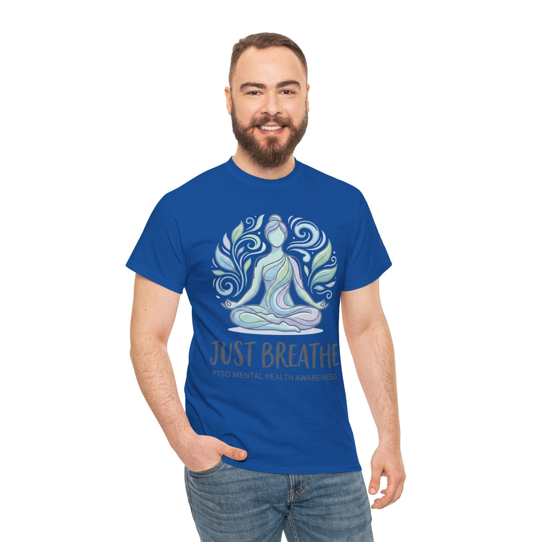 Blue T-shirt by Veteran owned, displaying a meditating figure and "Just Breathe" text, worn with jeans.