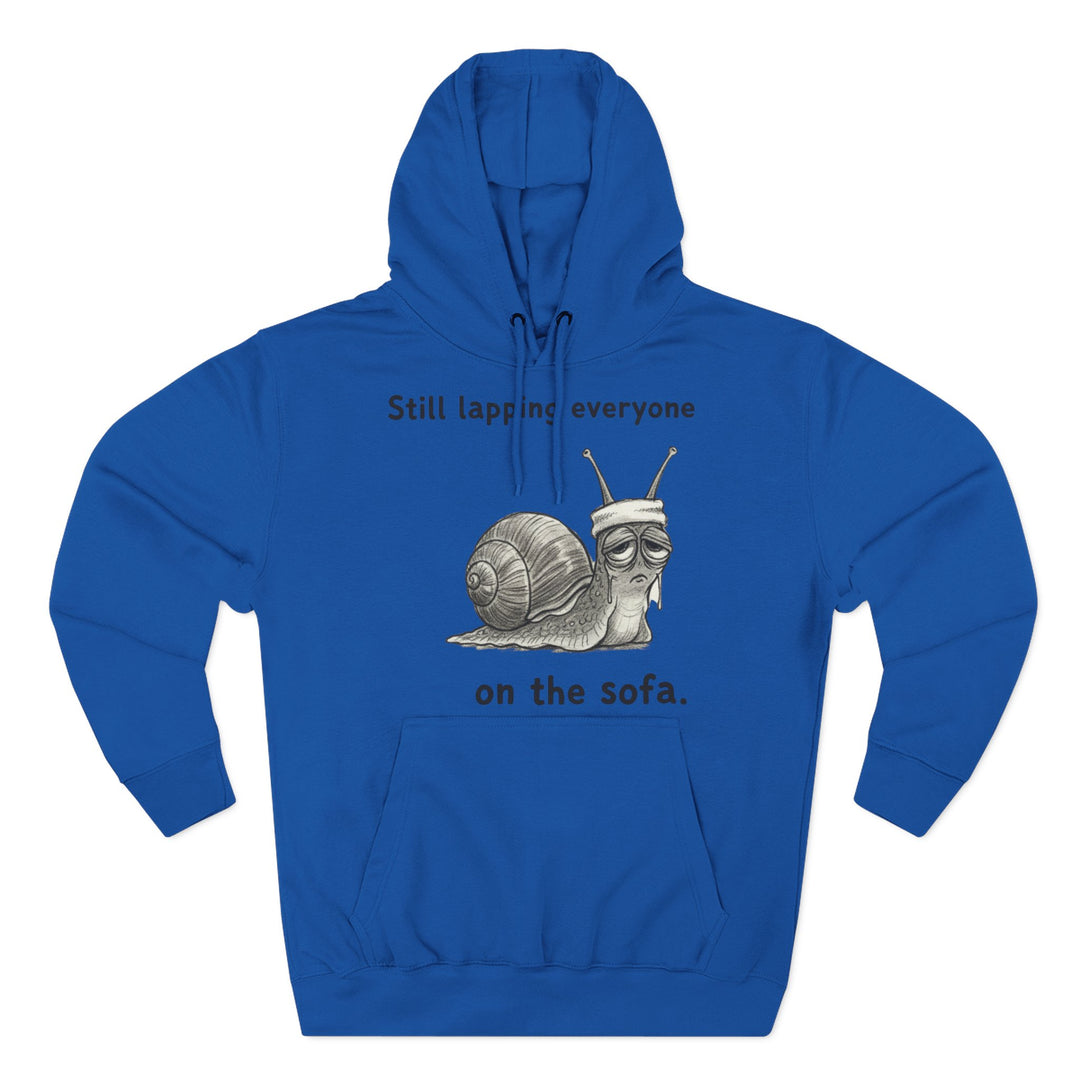 Blue hoodie by S&amp;W Gallus featuring a snail with a sweatband and the text "Still lapping everyone on the sofa".
