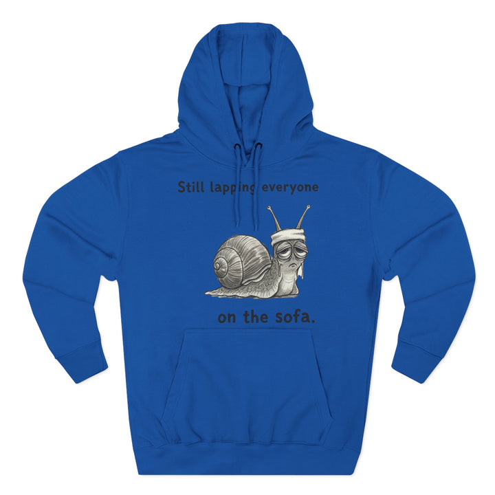 Blue hoodie by S&amp;W Gallus featuring a snail with a sweatband and the text "Still lapping everyone on the sofa".