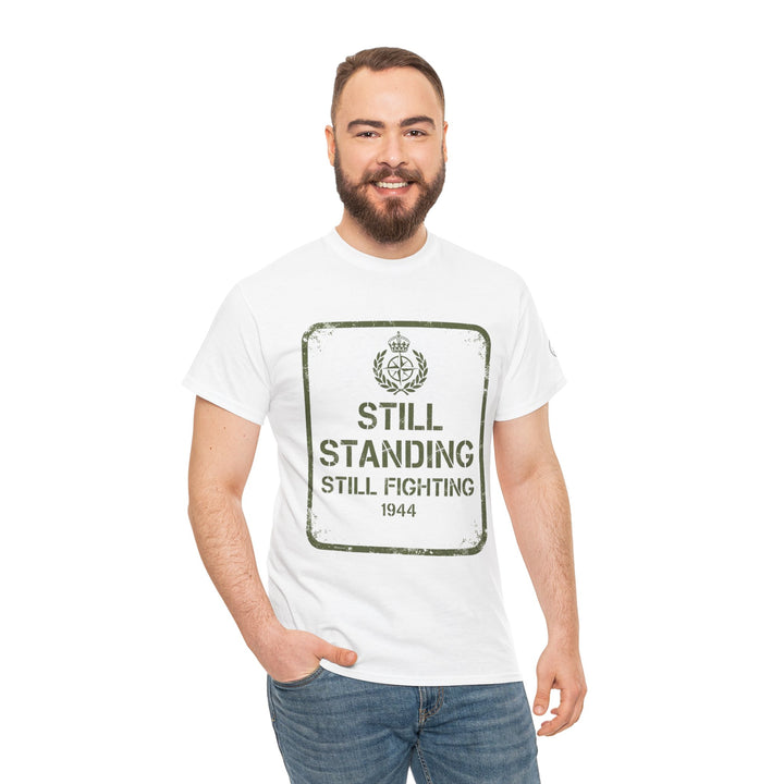 White "Still Standing" graphic T-shirt by S&amp;W Gallus, featuring a military-themed design and the year 1944, styled on a man.