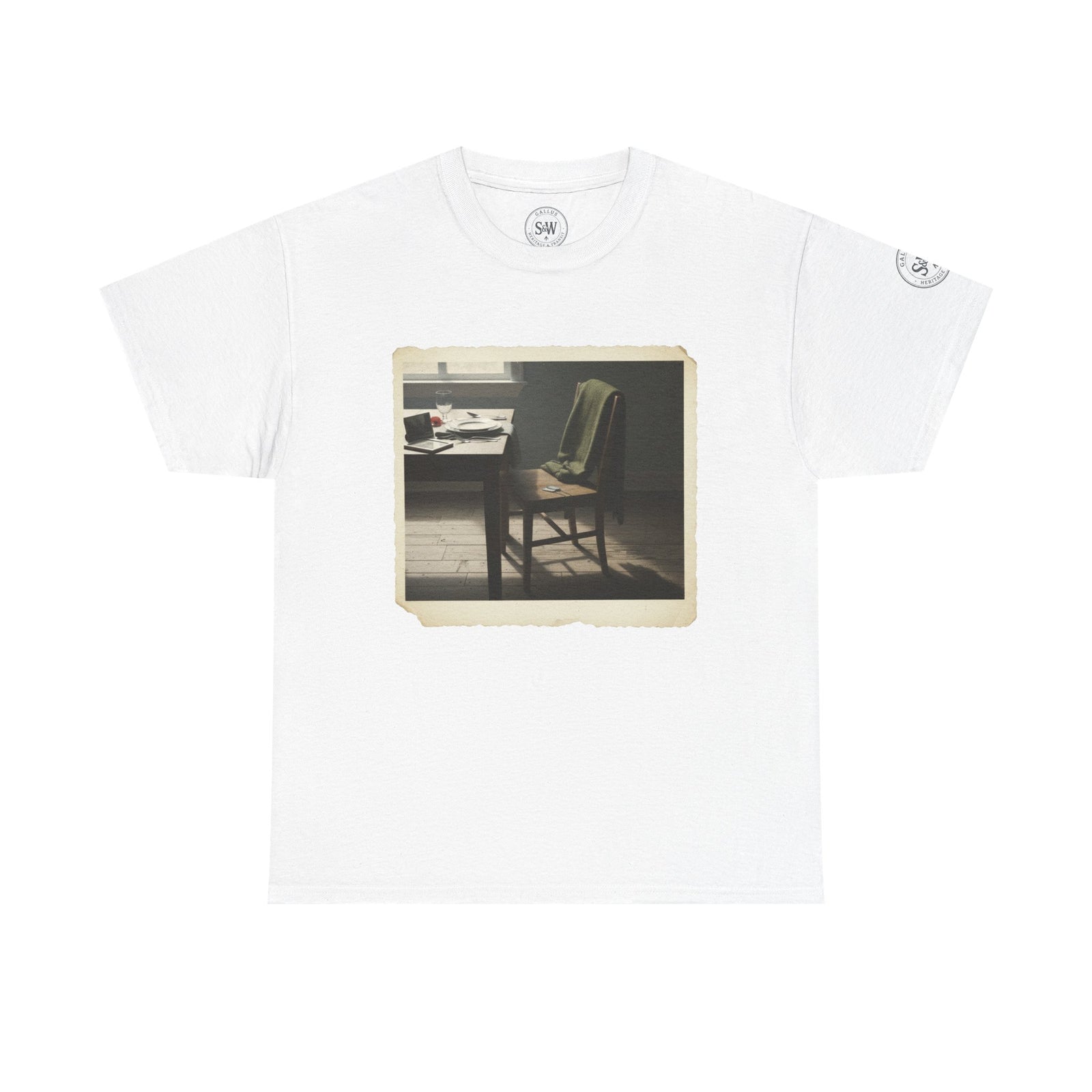 White t-shirt by S&W Gallus featuring a vintage-style photo print of an empty chair and table setting.
