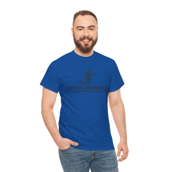Blue t-shirt by S&amp;W Gallus, featuring a humorous military graphic, styled with jeans and worn by a smiling man.