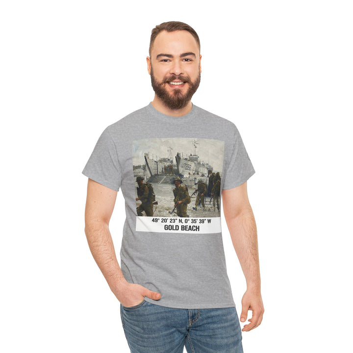 Gray t-shirt with a Gold Beach coordinates graphic by Veteran owned, worn with blue jeans on a smiling man.
