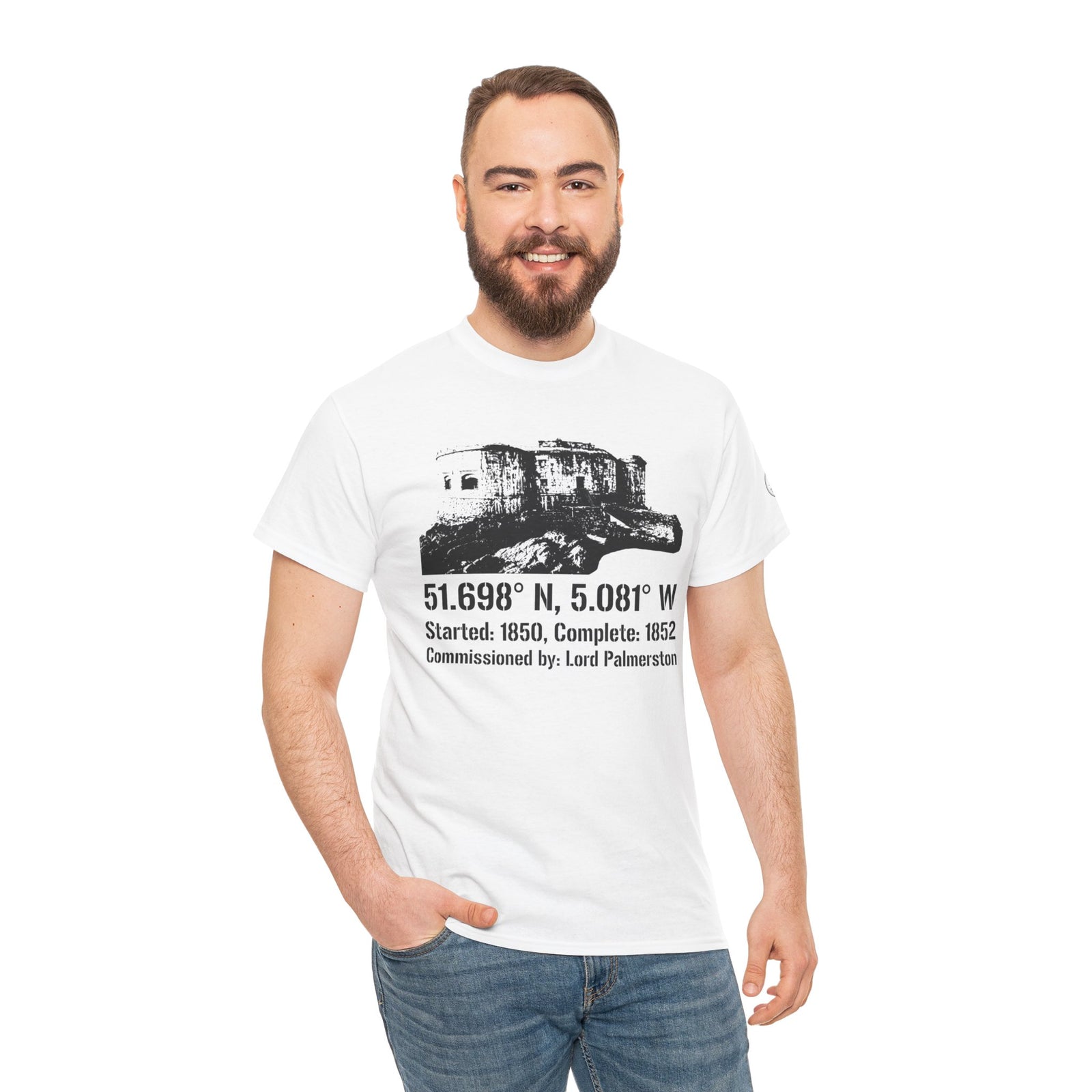 White T-shirt by S&W Gallus featuring a Stack Rock Fort graphic with coordinates and a historical inscription, worn with jeans.